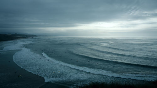 View of seascape against cloudy sky