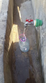 High angle view of water pipe on wall