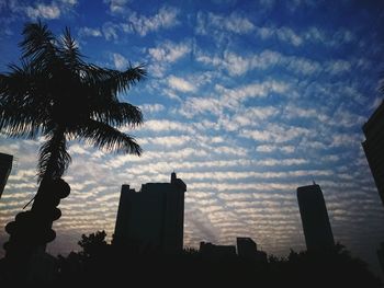 Low angle view of building against cloudy sky