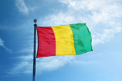 Low angle view of flag against sky