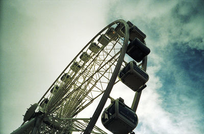 Low angle view of ferris wheel against sky