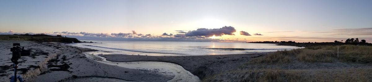 Panoramic view of sea against sky during sunset