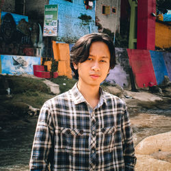 Portrait of young man looking at camera