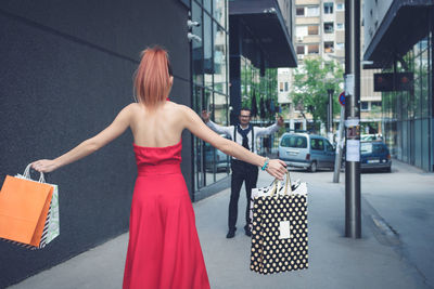 Woman walking on street in city