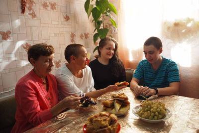 Group of people sitting on table