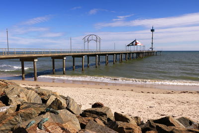 Pier over sea against sky