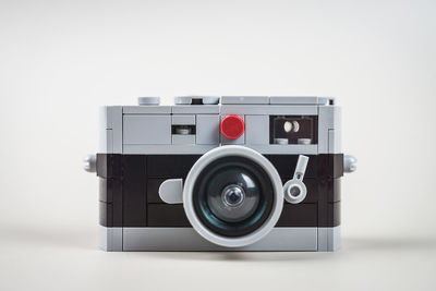 Close-up of vintage camera against white background