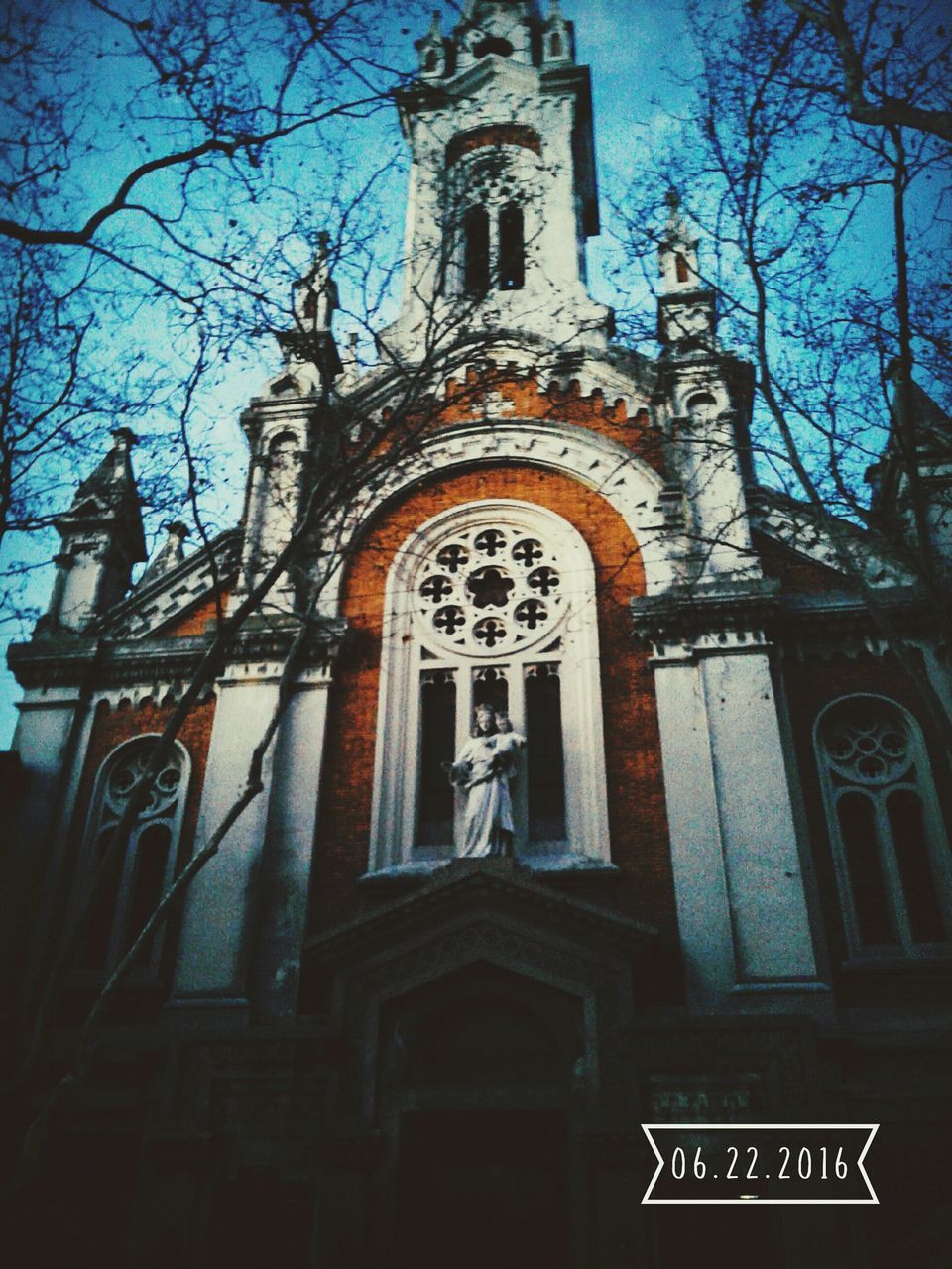 LOW ANGLE VIEW OF CHURCH WITH CHURCH IN BACKGROUND