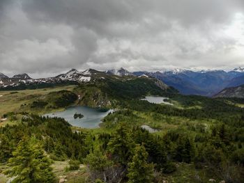 Scenic view of lake and mountains against sky