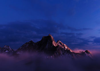 View of rock formation against sky at sunset