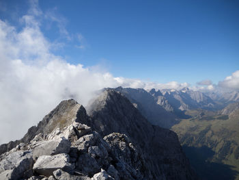 Rocky landscape against blue sky and clouds