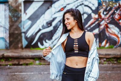 Young woman standing outdoors