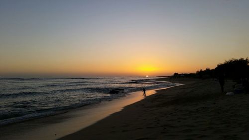 Scenic view of sea at sunset