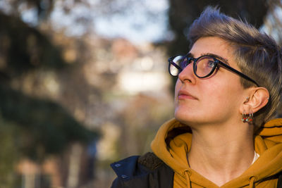 Young adult woman portrait at sunset in the park, tbilisi, georgia