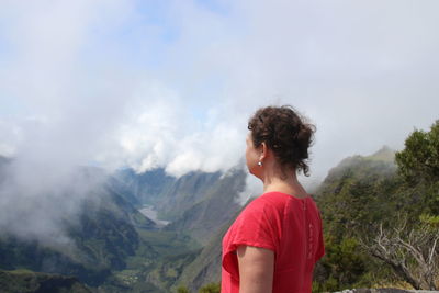 Woman looking over mountain