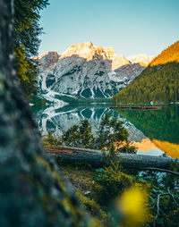 Scenic view of snowcapped mountains and lake against sky