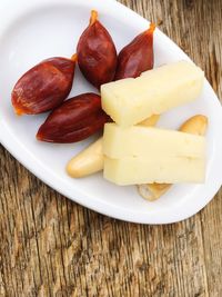 Close-up of fruits in plate on table