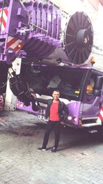 Full length of woman standing by railing