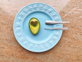 High angle view of fruits in plate on table