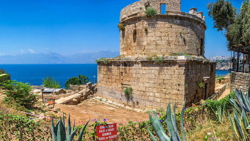 Ruins of the hidirlik tower in the old city of antalya, turkey, on a sunny summer day