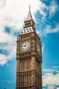 Low angle view of clock tower against sky