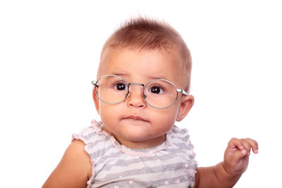 Portrait of cute baby against white background