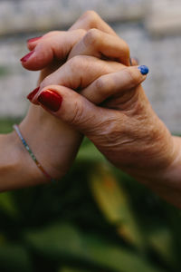 Close-up of woman holding hands