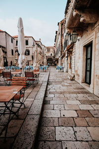 Footpath amidst buildings in town