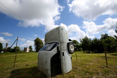 Built structure on field against sky