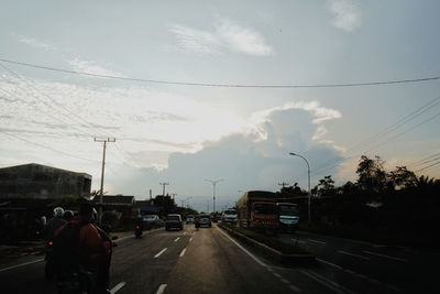 Man on road against sky