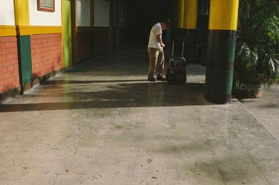 Surface level of man walking on window