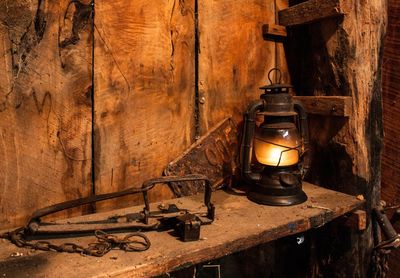 Old-fashioned lantern on wooden table