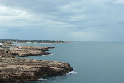 View of calm sea against cloudy sky