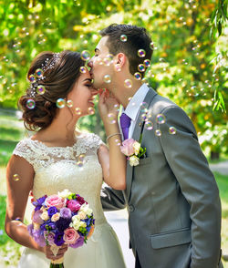 Close-up of woman holding flower bouquet