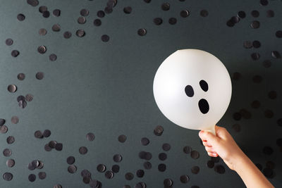 Close-up of person holding umbrella