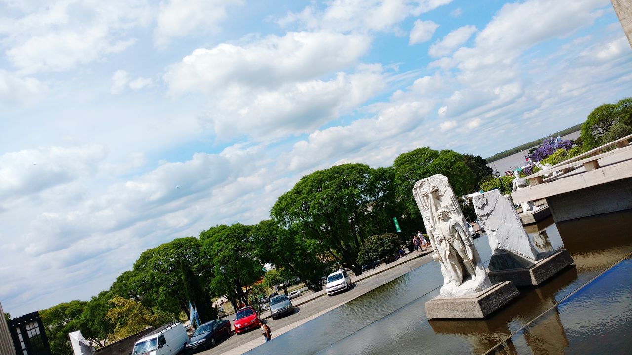 cloud - sky, sky, tree, statue, day, sculpture, built structure, outdoors, architecture, travel destinations, building exterior, low angle view, city, no people, nature