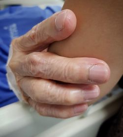 Close-up of person holding hands