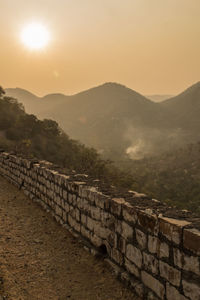 Scenic view of mountains against sky during sunset