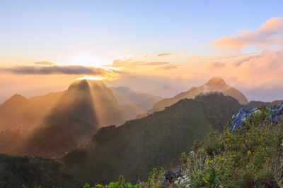 Scenic view of mountains against sky during sunset