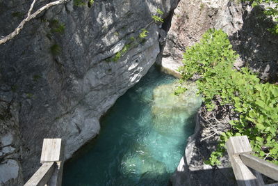 High angle view of water flowing through rocks