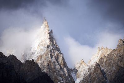 Low angle view of mountain against sky. karakoram and himalayas maintain range.