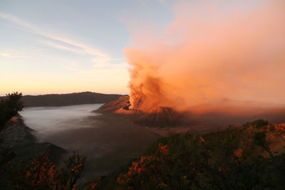 Scenic view of mountains against sky during sunset