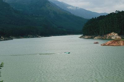 Scenic view of river and mountains