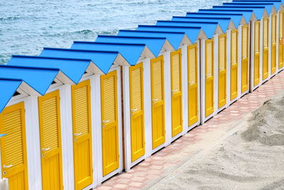 Row of beach huts against sea