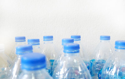 Close-up of bottles against white background