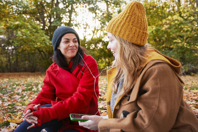 Happy friends in autumn scenery