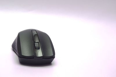 Close-up of computer mouse over white background