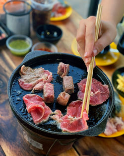 Cropped hand of person preparing food