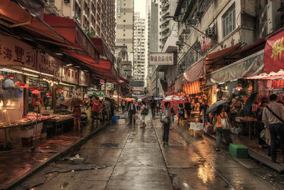 People walking on road in city