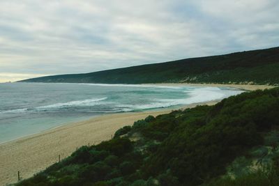 Scenic view of sea against cloudy sky